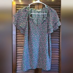 Pink and green floral shirt.